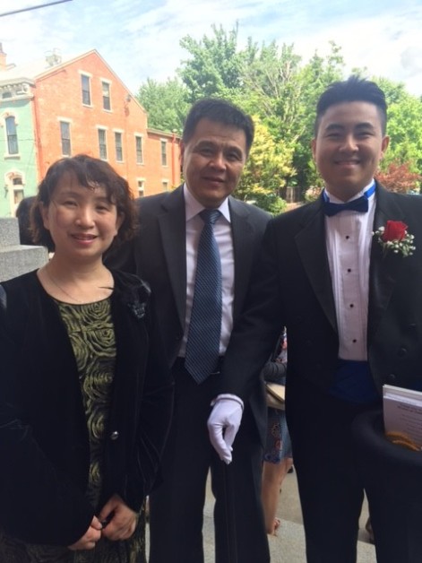 Jingjie Lin (Villa Madonna) along side his mother and father - graduation